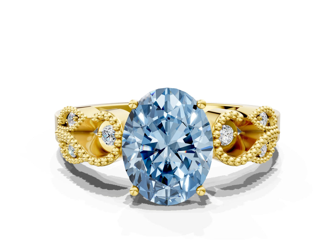 Yellow gold Fancy Blue Oval Cut Solitaire Milgrain Leaf Band with Prong Setting
