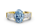 Yellow gold Fancy Blue Oval Cut Solitaire Princess Side Stone Engraved Band Prong Setting Ring
