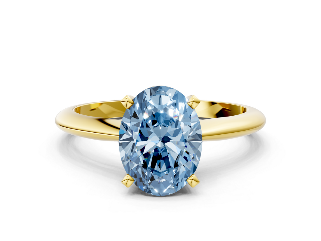 Yellow gold Fancy Blue Oval  Cut Solitaire Ring with Four-Prong Setting on a Classic Band_45