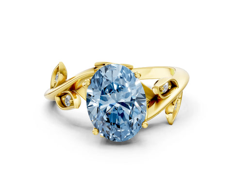Yellow gold Fancy Blue Oval Cut Solitaire Twist Engagement Ring with Leaf Accents and Prong Setting_13