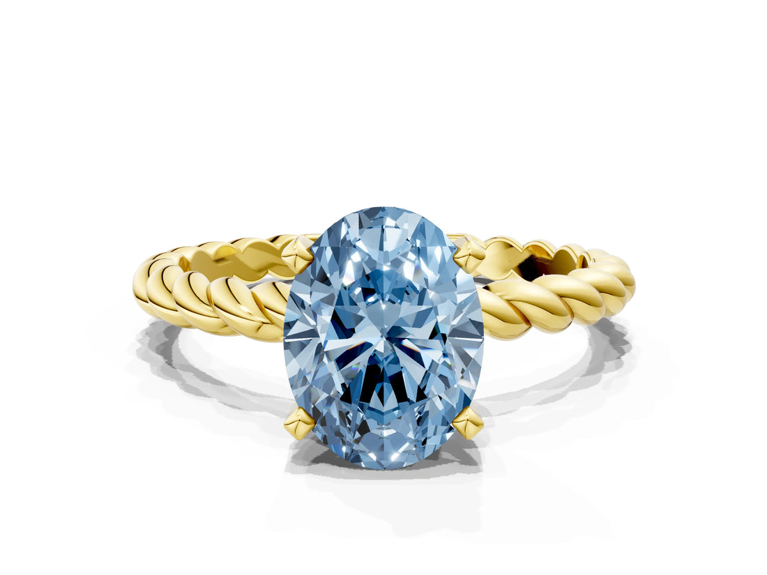 Yellow gold Fancy Blue Oval  Cut Solitaire Twisted Band with Four-Prong Setting_96