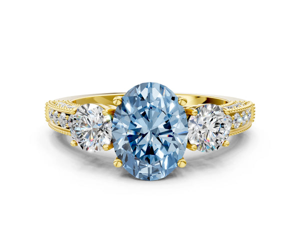 Yellow gold Fancy Blue Oval Cut Three-Stone Diamond Ring with Pavé Band and Four-Prong Setting