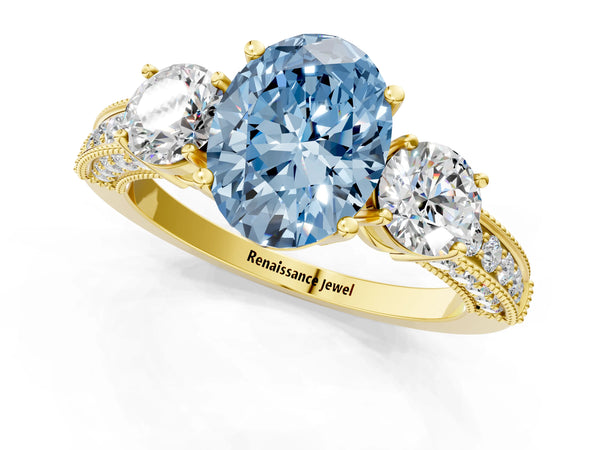 Yellow gold Fancy Blue Oval Cut Three-Stone Diamond Ring with Pavé Band and Four-Prong Setting