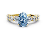 Yellow gold Fancy Blue Oval  Diamond Prong Setting with Side Stones on a Pave Band_136