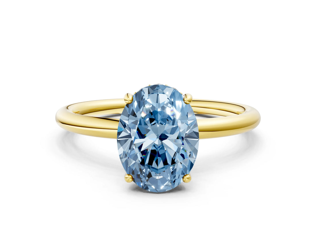 Yellow gold Fancy Blue Oval  Solitaire Diamond Ring with a Classic Band and Four-Prong Setting 1