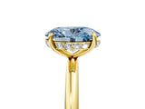 Yellow gold Fancy Blue Oval  Solitaire Diamond Ring with a Classic Band and Four-Prong Setting