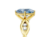 Yellow gold Fancy Blue Oval  Solitaire Twist Band with Leaf Prong Setting