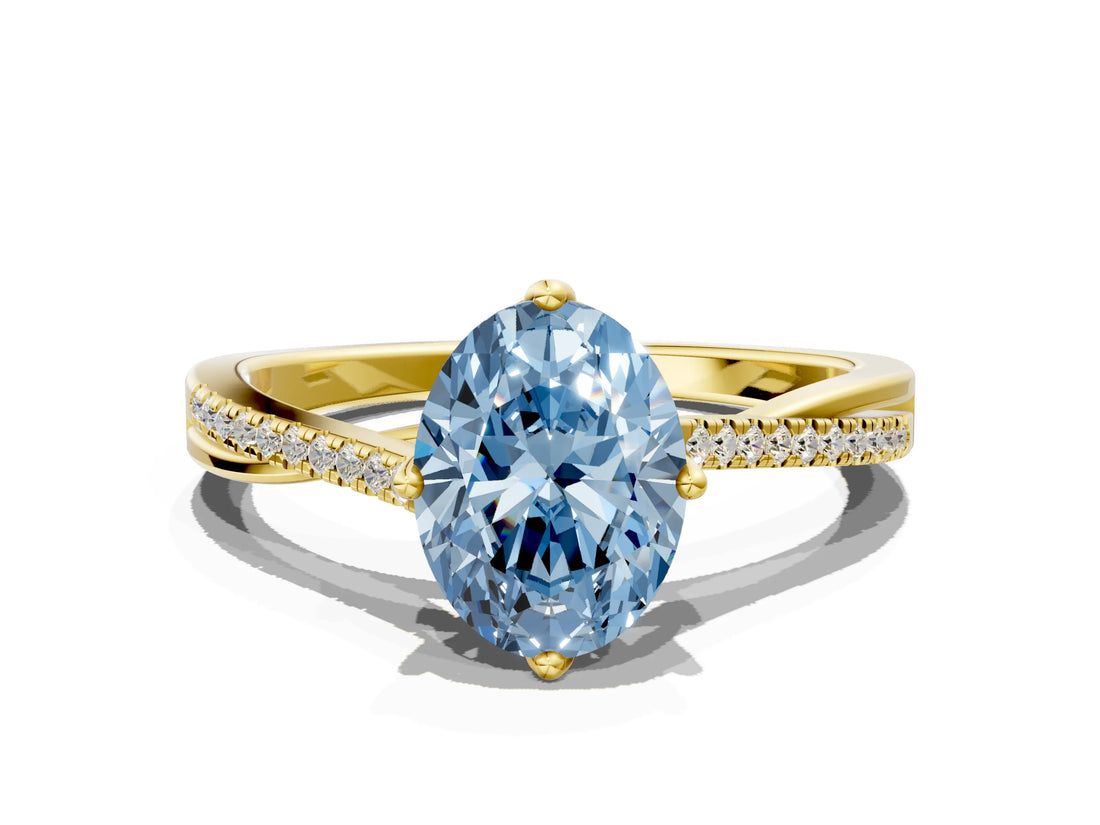 Yellow gold Fancy Blue Oval  Solitaire Twist Band with Pavé Diamonds and Four-Prong Setting_85