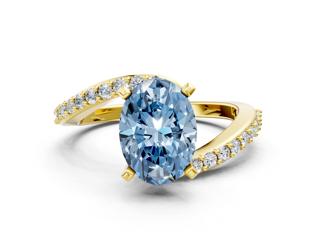 Yellow gold Fancy Blue Oval  Solitaire Twist Band with Pave Set Diamonds and Four-Prong Setting_125