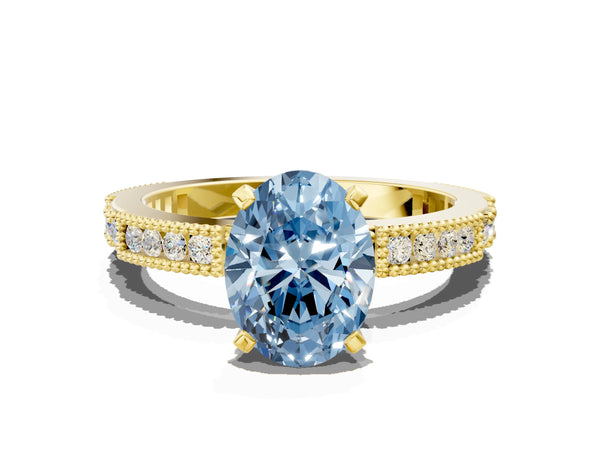 Yellow gold Fancy Blue Oval  Solitaire with Pavé Band and Four-Prong Setting