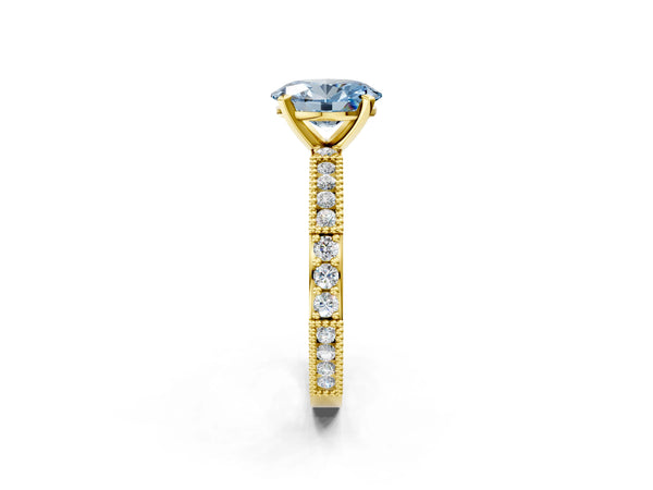 Yellow gold Fancy Blue Oval  Solitaire with Pavé Band and Four-Prong Setting