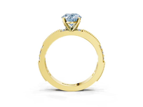 Yellow gold Fancy Blue Oval  Solitaire with Pavé Band and Four-Prong Setting