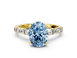 Yellow gold Fancy Blue Oval  Solitaire with Side Baguettes and Channel Set Band_44