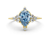 Yellow gold Fancy Blue Pear Cut Brilliant Diamond with Cluster Setting on a Beaded Band and Four-Prong Setting