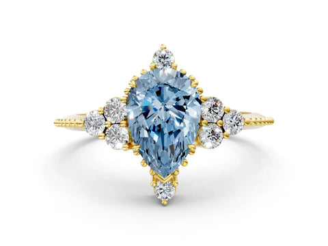 Yellow gold Fancy Blue Pear Cut Brilliant Diamond with Cluster Setting on a Beaded Band and Four-Prong Setting