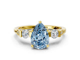 Yellow gold Fancy Blue Pear Cut Brilliant Three-Stone Pave Band with Four-Prong Setting
