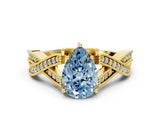 Yellow gold Fancy Blue Pear Cut Cut Diamond Twisted Band with Milgrain Pave Setting and Four-Prong Setting