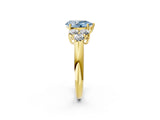 Yellow gold Fancy Blue Pear  Cut Diamond Cluster Ring with Round Accent Stones and Prong Setting on a Classic Band_80