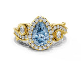 Yellow gold Fancy Blue Pear Cut Diamond Halo Ring with Milgrain Pavé Band and Four-Prong Setting_54