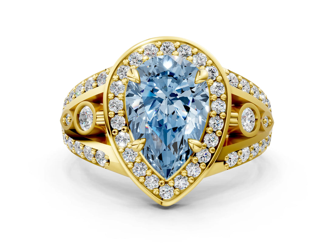 Yellow gold Fancy Blue Pear Cut Diamond Halo Ring with Split Shank and Bezel Accents and Four-Prong Setting