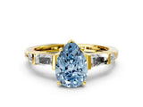 Yellow gold Fancy Blue Pear  Cut Diamond Ring with Baguette Side Stones, Channel Set Band, and Four-Prong Setting_24