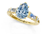 Yellow gold Fancy Blue Pear  Cut Diamond Ring with Baguette Side Stones, Channel Set Band, and Four-Prong Setting_25