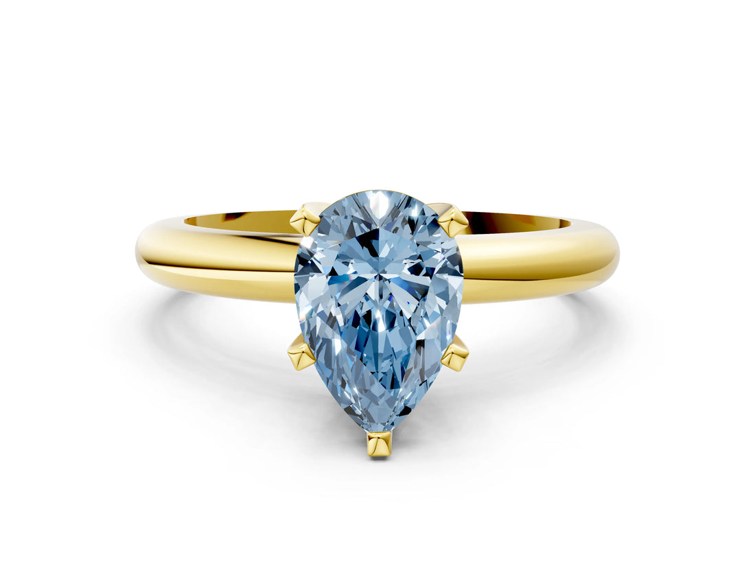 Yellow gold Fancy Blue Pear Cut Diamond Solitaire Engagement Ring with Round Band and Four-Prong Setting_138