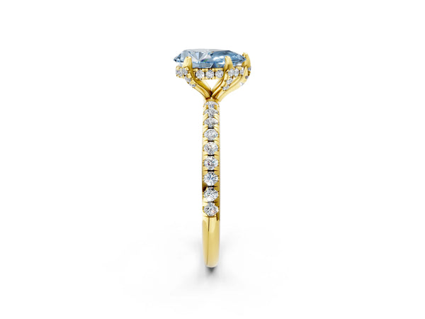Yellow gold Fancy Blue Pear Cut Diamond Solitaire Ring with Four-Prong Setting and Pavé Band