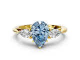 Yellow gold Fancy Blue Pear Cut Diamond Three-Stone Ring with Pear Side Stones and Four-Prong Setting_89