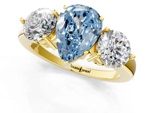 Yellow gold Fancy Blue Pear Cut Diamond Three-Stone Ring with Prong Setting and Classic Band