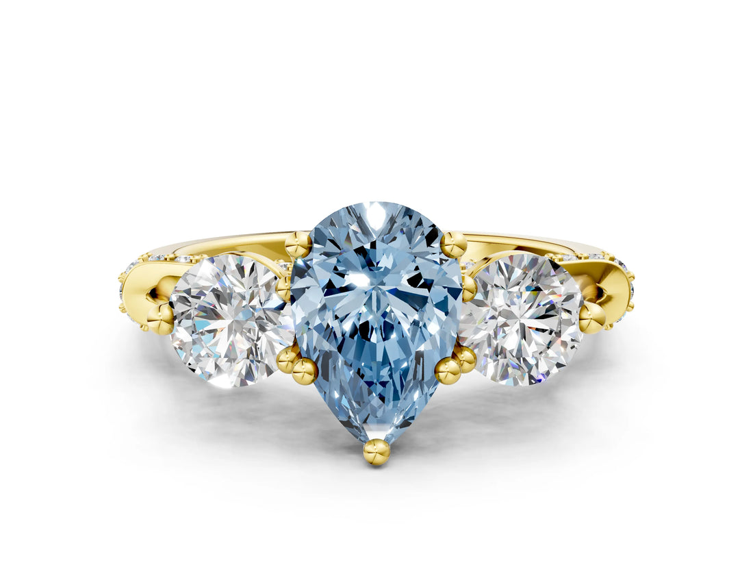Yellow gold Fancy Blue Pear Cut Diamond Three-Stone Ring with Prong Setting and Pavé Band