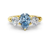 Yellow gold Fancy Blue Pear Cut Diamond Three-Stone Ring with Prong Setting and Pavé Band