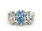Yellow gold Fancy Blue Pear Cut Diamond Three-Stone Ring with Prong Setting and Textured Band
