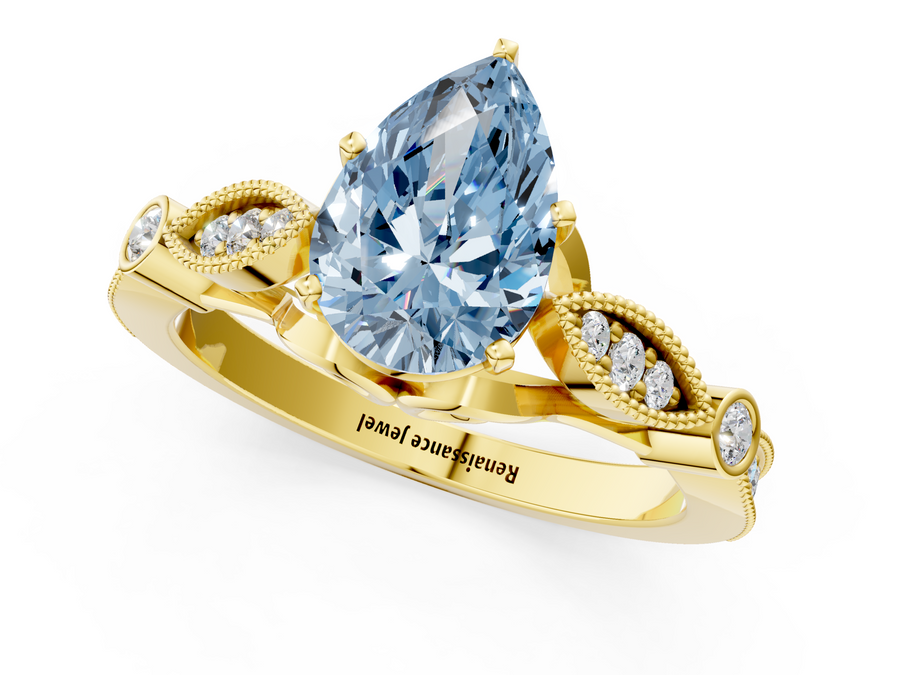 Yellow gold Fancy Blue Pear  Cut Diamond with Milgrain Marquise and Bezel Accents on a Solitaire Band with Prong Setting