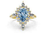 Yellow gold Fancy Blue Pear Cut Halo Diamond Cluster Ring with Marquise and Round Stones on a White Gold Band with Prong Setting