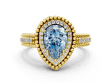 Yellow gold Fancy Blue Pear Cut Halo Diamond Ring with Beaded Split Shank and Four-Prong Setting