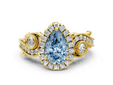 Yellow gold Fancy Blue Pear Cut Halo Diamond Ring with Milgrain and Bezel Accents on a Split Shank Band_12