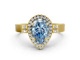 Yellow gold Fancy Blue Pear Cut Halo Round Diamond Twist Band with Four-Prong Setting