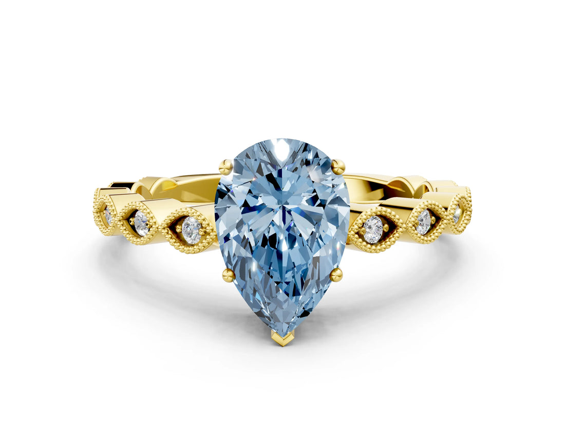 Yellow gold Fancy Blue Pear Cut Solitaire Diamond Ring with Infinity Twist Band and Four-Prong Setting