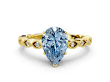 Yellow gold Fancy Blue Pear Cut Solitaire Diamond Ring with Infinity Twist Band and Four-Prong Setting
