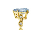 Yellow gold Fancy Blue Pear Cut Solitaire Diamond Ring with Infinity Twist Band and Four-Prong Setting_5