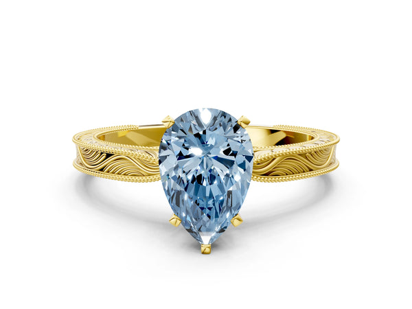 Yellow gold Fancy Blue Pear Cut Solitaire Milgrain Engraved Band with Four-Prong Setting