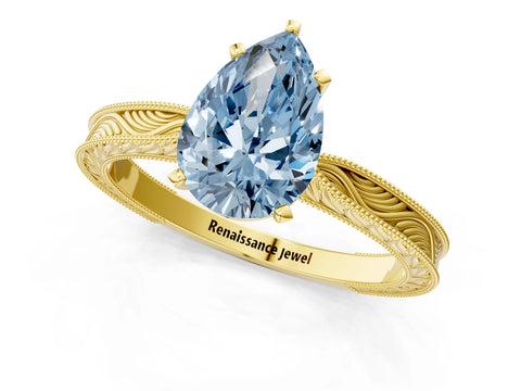 Yellow gold Fancy Blue Pear Cut Solitaire Milgrain Engraved Band with Four-Prong Setting_1