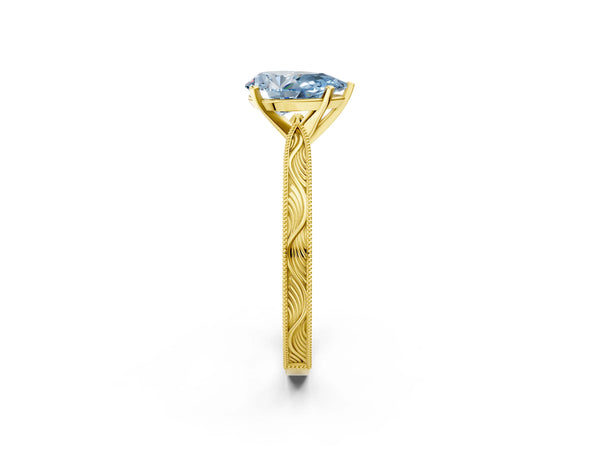 Yellow gold Fancy Blue Pear Cut Solitaire Milgrain Engraved Band with Four-Prong Setting