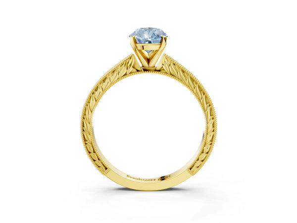 Yellow gold Fancy Blue Pear Cut Solitaire Milgrain Engraved Band with Four-Prong Setting