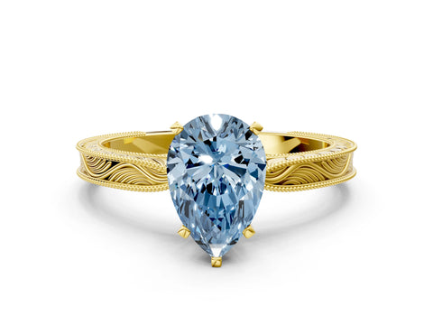 Yellow gold Fancy Blue Pear Cut Solitaire Milgrain Engraved Band with Four-Prong Setting