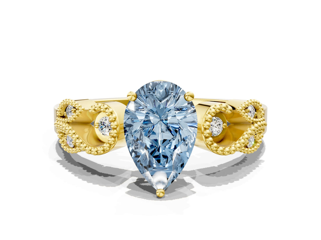 Yellow gold Fancy Blue Pear Cut Solitaire Milgrain Leaf Band with Prong Setting