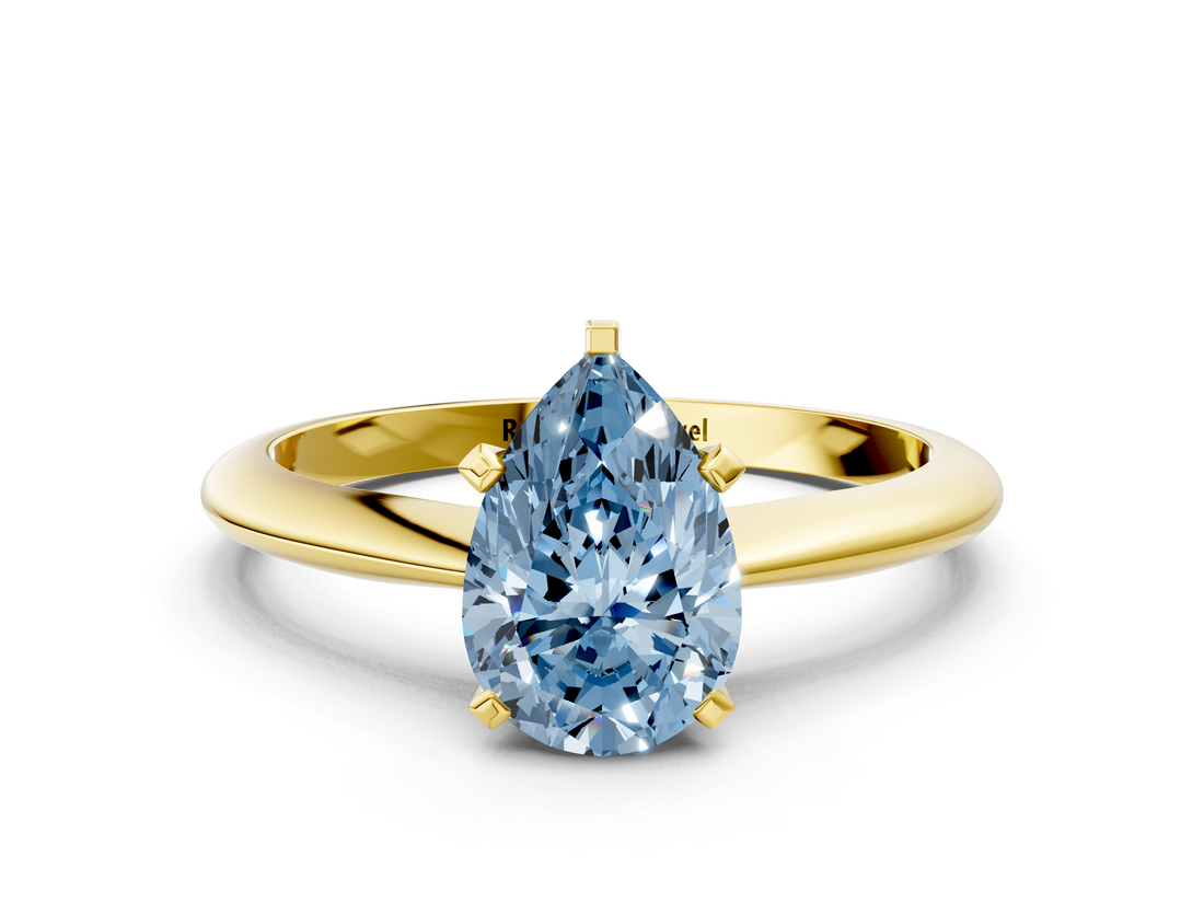 Yellow gold Fancy Blue Pear  Cut Solitaire Ring with Four-Prong Setting on a Classic Band_70