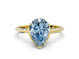 Yellow gold Fancy Blue Pear Cut Solitaire Split Shank Pave Diamond Engagement Ring with Four-Prong Setting