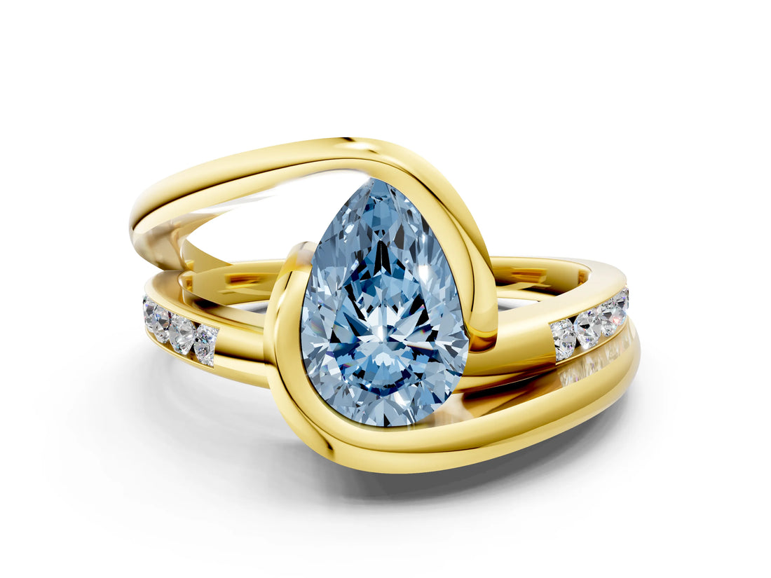 Yellow gold Fancy Blue Pear Cut Solitaire Tension-Set Diamond Split Shank Ring
